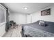 Spacious bedroom with a king-size bed and a rocking chair at 1502 Carmelita Ct, Platteville, CO 80651