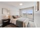 Cozy bedroom features natural light, soft carpeting, and neutral walls at 2418 Coach House Loop, Castle Rock, CO 80109