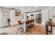 Modern kitchen with stainless steel appliances, a large island with seating, and lots of natural light at 2418 Coach House Loop, Castle Rock, CO 80109