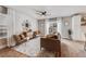 Comfortable living room with stylish decor, natural light, and a cozy seating area with a large rug at 2418 Coach House Loop, Castle Rock, CO 80109