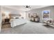 Spacious main bedroom with lots of natural light, neutral paint, and stylish decor at 2418 Coach House Loop, Castle Rock, CO 80109