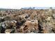 Expansive aerial view of a neighborhood with a vibrant cityscape skyline in the background at 55 S Grant St, Denver, CO 80209