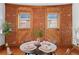 Elegant dining space featuring hardwood floors and exposed brick window surrounds at 55 S Grant St, Denver, CO 80209