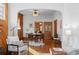 Open-concept dining area with hardwood floors, stylish furniture, and natural light at 55 S Grant St, Denver, CO 80209