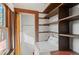 Functional laundry area with a washing machine, shelving, and natural light, providing a practical space for chores at 55 S Grant St, Denver, CO 80209