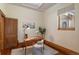 Charming home office featuring a wooden desk, vintage chair, natural light, and a cozy atmosphere for productivity at 55 S Grant St, Denver, CO 80209