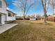 Large backyard with grass, trees, and a shed at 5599 W 115Th Ave, Westminster, CO 80020