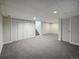 Unfinished basement with gray carpet and ample storage at 5599 W 115Th Ave, Westminster, CO 80020