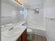 Bathroom with shower/tub combo, white vanity, and gray flooring at 5599 W 115Th Ave, Westminster, CO 80020