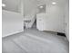 Entryway with gray carpeting, stairs, and loft view at 5599 W 115Th Ave, Westminster, CO 80020