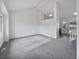 Two-story living room with gray carpeting and loft view at 5599 W 115Th Ave, Westminster, CO 80020