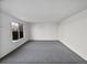 Spacious living room with gray carpet and large window at 5599 W 115Th Ave, Westminster, CO 80020