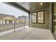 Covered back patio with view of backyard and neighboring homes at 1853 Hickory Ave, Erie, CO 80516