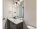 Modern bathroom with single vanity, marble countertop, and a toilet at 1853 Hickory Ave, Erie, CO 80516