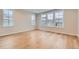 Bright bedroom with hardwood floors and multiple windows at 1853 Hickory Ave, Erie, CO 80516