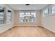Spacious dining area with hardwood floors and abundant natural light from large windows at 1853 Hickory Ave, Erie, CO 80516