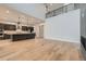 Open living room with hardwood floors and high ceilings at 1853 Hickory Ave, Erie, CO 80516