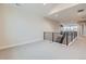 Open upper hall with modern railing and carpet at 1853 Hickory Ave, Erie, CO 80516