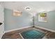 Finished basement area featuring newer windows and a stylish accent rug at 2300 Jasmine St, Denver, CO 80207