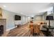 Finished basement living area with stone fireplace and ample seating at 2300 Jasmine St, Denver, CO 80207