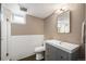 Basement bathroom featuring modern tile, vanity and mirror at 2300 Jasmine St, Denver, CO 80207