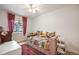Bright bedroom with a daybed, large window and comfortable stylish furnishings at 2300 Jasmine St, Denver, CO 80207