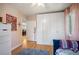 Bright bedroom featuring generous closet space, a stylish bed, and warm wooden floors at 2300 Jasmine St, Denver, CO 80207