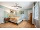 This charming bedroom features beautiful hardwood floors and natural light at 2300 Jasmine St, Denver, CO 80207