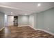Large bonus room with neutral walls, wood-look flooring, and recessed lighting, ready for your personal design at 2300 Jasmine St, Denver, CO 80207