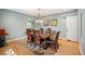 Spacious dining room with hardwood floors, a large table, and natural light, great for gatherings at 2300 Jasmine St, Denver, CO 80207