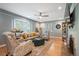 Bright, airy living room with a bay window, fireplace, comfortable seating, and stylish décor at 2300 Jasmine St, Denver, CO 80207