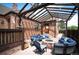Inviting brick patio featuring a stone fire pit and comfortable seating area, perfect for outdoor entertaining at 2300 Jasmine St, Denver, CO 80207