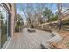 Relaxing back deck with bench seating and lush landscaped yard at 15846 W Bayaud Dr, Golden, CO 80401