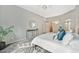 Bedroom featuring a gray bed frame, a decorative rug, and an open hallway at 15846 W Bayaud Dr, Golden, CO 80401