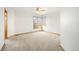 Carpeted bedroom featuring a large window that offers ample natural light, creating a cozy and inviting atmosphere at 15846 W Bayaud Dr, Golden, CO 80401