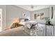 Cozy bedroom featuring a gray bed frame, a decorative rug, and a window with a view at 15846 W Bayaud Dr, Golden, CO 80401