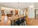 Elegant dining room offering hardwood floors and an open view into the kitchen at 15846 W Bayaud Dr, Golden, CO 80401