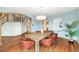 Dining room with hardwood floors, light blue walls, and a wooden table with leather chairs at 15846 W Bayaud Dr, Golden, CO 80401