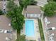 Aerial view of complex showing pool, landscaping, and buildings at 13404 E Jewell Ave # 101, Aurora, CO 80012