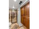 Bathroom featuring glass shower doors and storage cabinets at 13404 E Jewell Ave # 101, Aurora, CO 80012
