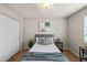 Inviting bedroom features a ceiling fan, comfortable bed, and ample natural light at 13404 E Jewell Ave # 101, Aurora, CO 80012