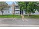 Comfortable two-story condo with dual balconies, a stone chimney and reserved parking spaces at 13404 E Jewell Ave # 101, Aurora, CO 80012