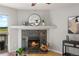 Inviting fireplace with wood-burning insert, stone surround and decorative mantel at 13404 E Jewell Ave # 101, Aurora, CO 80012
