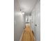 Hallway featuring beautiful hard wood flooring and multiple doors at 13404 E Jewell Ave # 101, Aurora, CO 80012