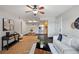 Open living space with hardwood floors seamlessly connects to kitchen and dining area at 13404 E Jewell Ave # 101, Aurora, CO 80012