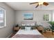 Bright bedroom with comfortable bedding, stylish decor, and plenty of natural light from large windows at 13404 E Jewell Ave # 101, Aurora, CO 80012