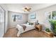 Well-lit bedroom featuring neutral walls, cozy bedding, and side tables that add warmth and character at 13404 E Jewell Ave # 101, Aurora, CO 80012
