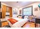 Bright bedroom with stylish décor, wood floors and large window at 1365 N Corona St # 11, Denver, CO 80218