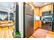 View of kitchen featuring wood cabinets, stainless steel refrigerator and modern appliances at 1365 N Corona St # 11, Denver, CO 80218