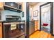 Stainless steel oven and microwave in a kitchen with direct access to a bathroom at 1365 N Corona St # 11, Denver, CO 80218